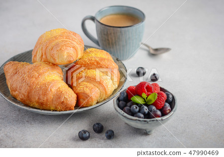 Fresh Croissants with berries. 47990469