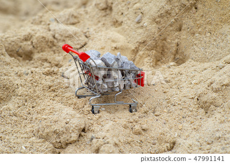 Shopping trolley stand on the pile of sand 47991141