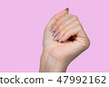 female hands with old silver shiny manicure 47992162