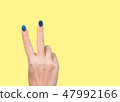Woman hand with two fingers up making v sign 47992166