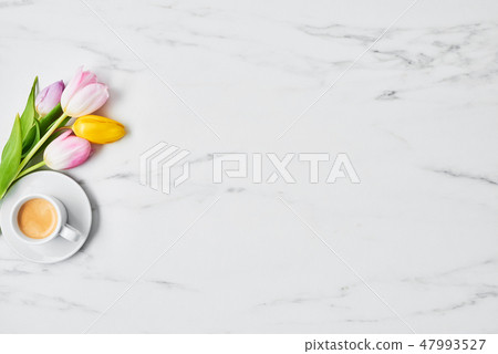 Cup of coffee with tulips Cup of coffee with tulips 47993527