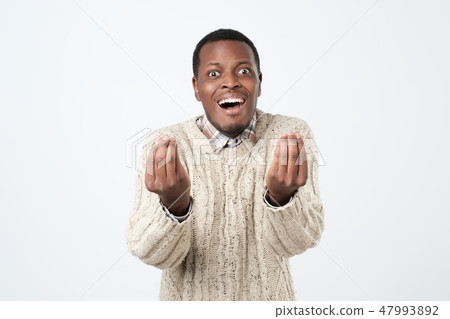 African man showing italian gesture that means what do you want over white background. 47993892