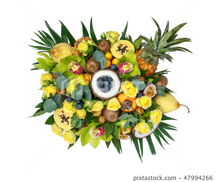 Wooden box with lots of exotic fruits and flowers 47994266