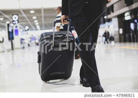 airport, business man, a suitcase 47996921