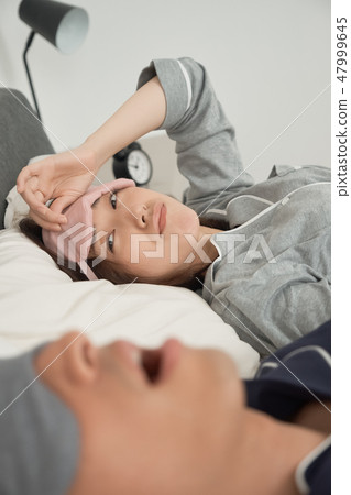 Couples suffering from snoring 47999645