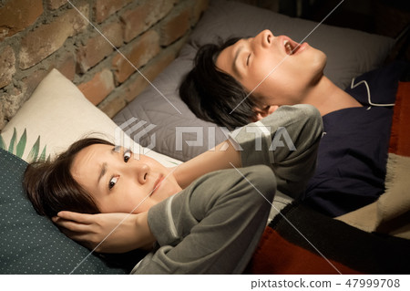 Couples suffering from snoring 47999708