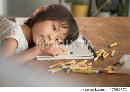 Children playing in the living room 47999772