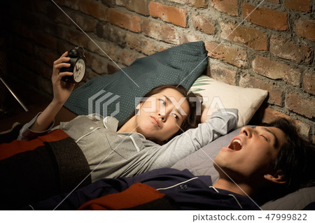 Couples suffering from snoring Couples suffering from snoring 47999822