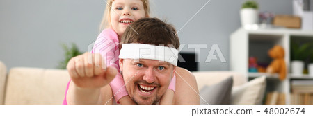 Smiling joy happy daughter play with father Smiling joy happy daughter play with father 48002674
