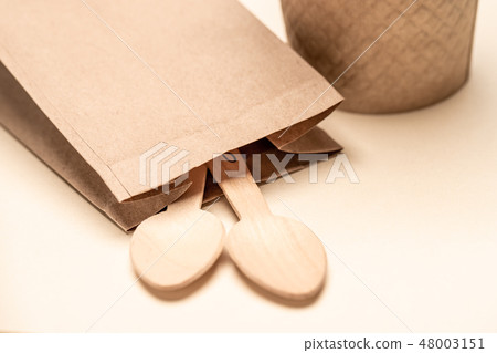 Eco-friendly disposable utensils made of bamboo wood and paper Wooden spoon Eco-friendly disposable utensils made of bamboo wood and paper Wooden spoon 48003151