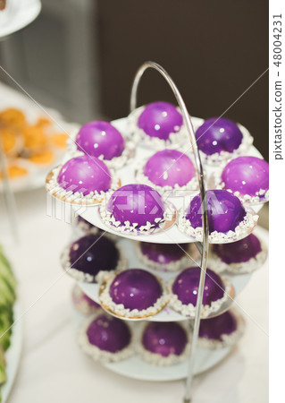 Different kinds of baked sweets on a buffet Different kinds of baked sweets on a buffet 48004231