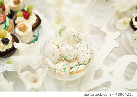 Different kinds of baked sweets on a buffet Different kinds of baked sweets on a buffet 48004233
