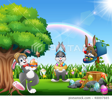 Easter bunnies and colorful egg on the garden Easter bunnies and colorful egg on the garden 48007885