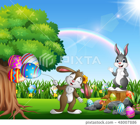 Easter bunnies and colorful egg on the garden Easter bunnies and colorful egg on the garden 48007886