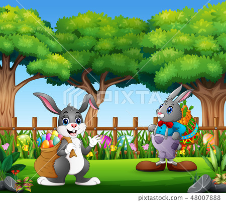 Easter bunnies and colorful egg on the garden Easter bunnies and colorful egg on the garden 48007888