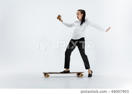 businesswoman riding skate on white background 48007903