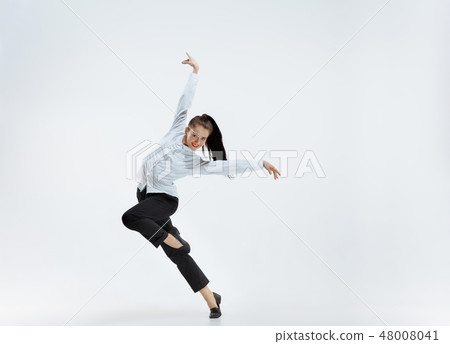 Happy business woman dancing and smiling isolated on white. 48008041