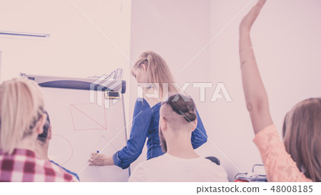 Teacher teaching mathematics to college students 48008185