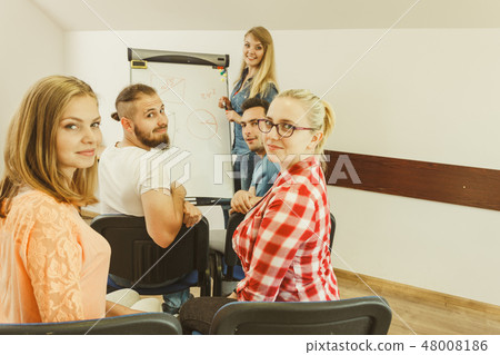 Teacher teaching mathematics to college students 48008186