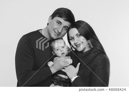 baby on the hands of parents on a white background baby on the hands of parents on a white background 48008424