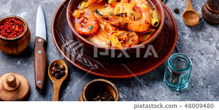 Bowl of fresh seafood soup 48009480