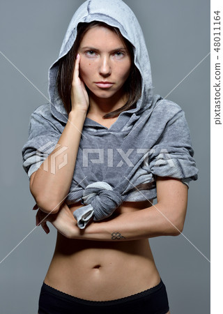 Portrait of the beautiful woman in hoody blouse. Portrait of the beautiful woman in hoody blouse. 48011164