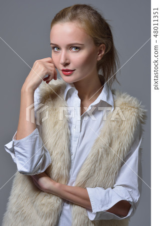 beautiful blonde woman in fur jacket. beautiful blonde woman in fur jacket. 48011351