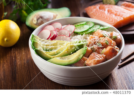 Poke bowl, traditional Hawaiian raw fish salad Poke bowl, traditional Hawaiian raw fish salad 48011370