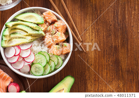 Poke bowl, traditional Hawaiian raw fish salad Poke bowl, traditional Hawaiian raw fish salad 48011371