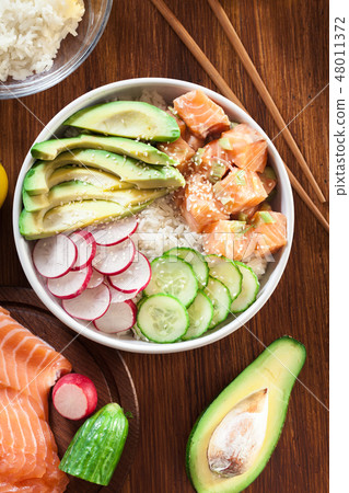 Poke bowl, traditional Hawaiian raw fish salad Poke bowl, traditional Hawaiian raw fish salad 48011372