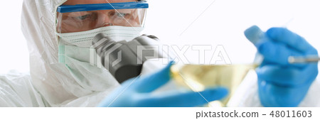 Male chemist in blue protective gloves look Male chemist in blue protective gloves look 48011603