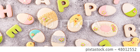 Happy Easter colorful lettering Happy Easter of ginger biscuits and cookies bunny as background. Happy Easter colorful lettering Happy Easter of ginger biscuits and cookies bunny as background. 48012552