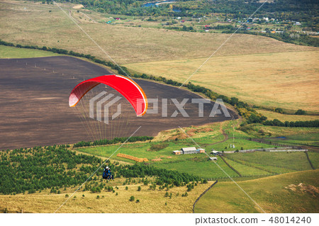 Paragliding in mountains 48014240