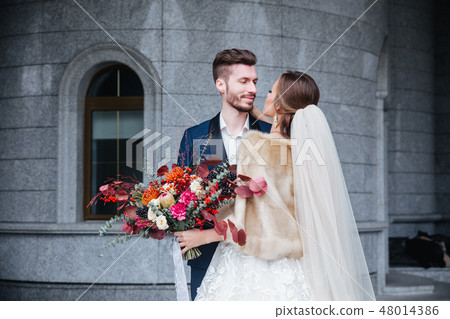 Happy romantic young couple celebrating their marriage Happy romantic young couple celebrating their marriage 48014386
