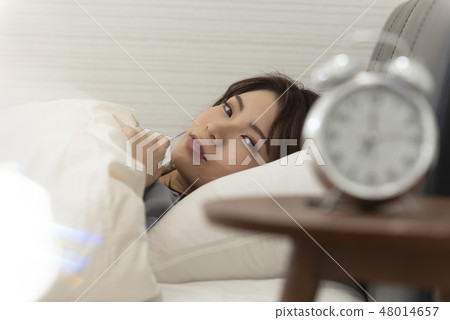 Waking up in the morning Sleeping woman lifestyle Waking up in the morning Sleeping woman lifestyle 48014657