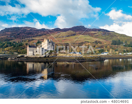 Aerial view of the historic Eilean Donan Castle by Dornie in autumn, Scotland Aerial view of the historic Eilean Donan Castle by Dornie in autumn, Scotland 48014691