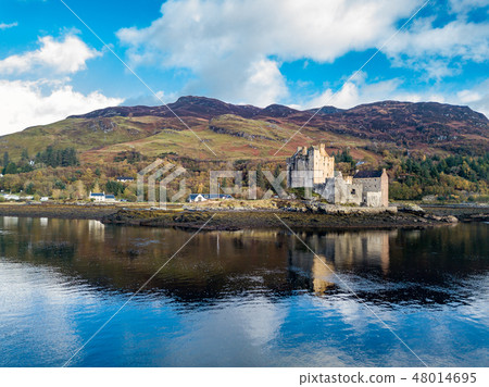 Aerial view of the historic Eilean Donan Castle by Dornie in autumn, Scotland Aerial view of the historic Eilean Donan Castle by Dornie in autumn, Scotland 48014695