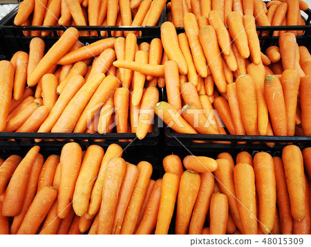 carrot in black basket sold in supermarket carrot in black basket sold in supermarket 48015309