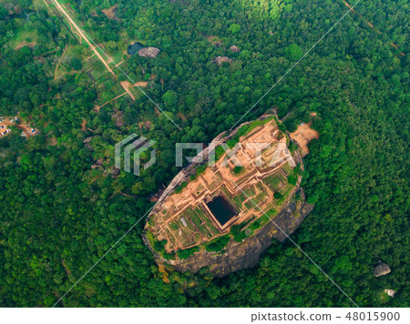 Aerial view of Sigiriya rock at misty morning, Sri Lanka. Drone footage Aerial view of Sigiriya rock at misty morning, Sri Lanka. Drone footage 48015900