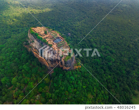 Aerial view of Sigiriya rock at misty morning, Sri Lanka. Drone footage Aerial view of Sigiriya rock at misty morning, Sri Lanka. Drone footage 48016245