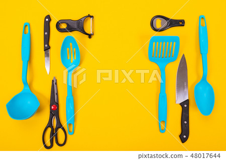 top view of stylish kitchen utensils isolated on yellow background top view of stylish kitchen utensils isolated on yellow background 48017644