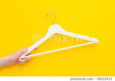 White hangers background for sale shopping concept White hangers background for sale shopping concept 48018455