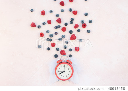 Valentine Day composition berries alarm clock Valentine Day composition berries alarm clock 48018458