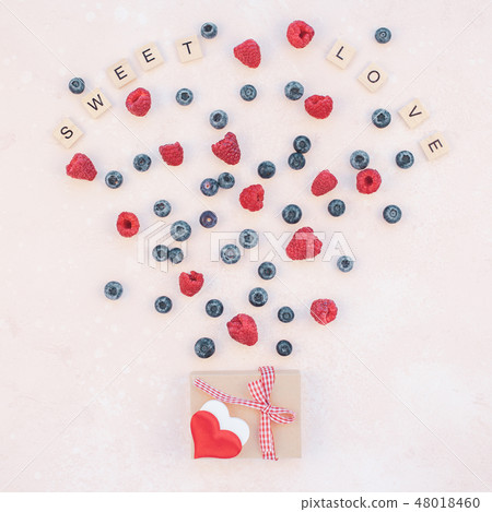 Valentine Day composition berries and gift box Valentine Day composition berries and gift box 48018460
