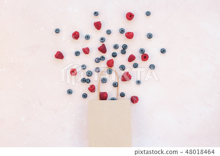 Shopping composition berries flying from bag Shopping composition berries flying from bag 48018464
