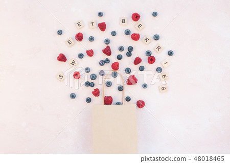 Shopping composition berries flying from bag 48018465