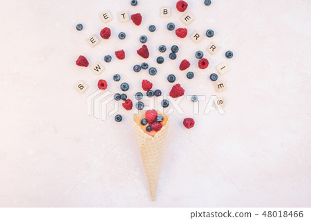 Summer composition berries ice cream waffle cone Summer composition berries ice cream waffle cone 48018466