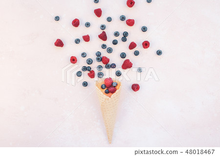 Summer composition berries ice cream waffle cone Summer composition berries ice cream waffle cone 48018467