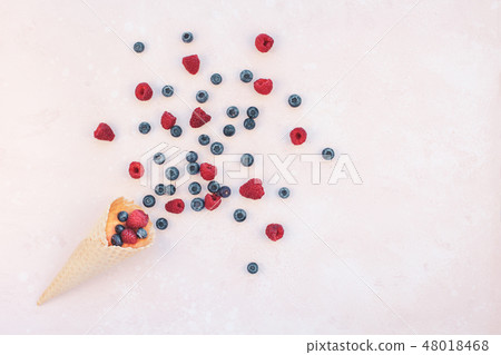 Summer composition berries ice cream waffle cone Summer composition berries ice cream waffle cone 48018468