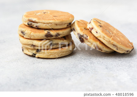 Stack of welsh cakes on off white 48018596